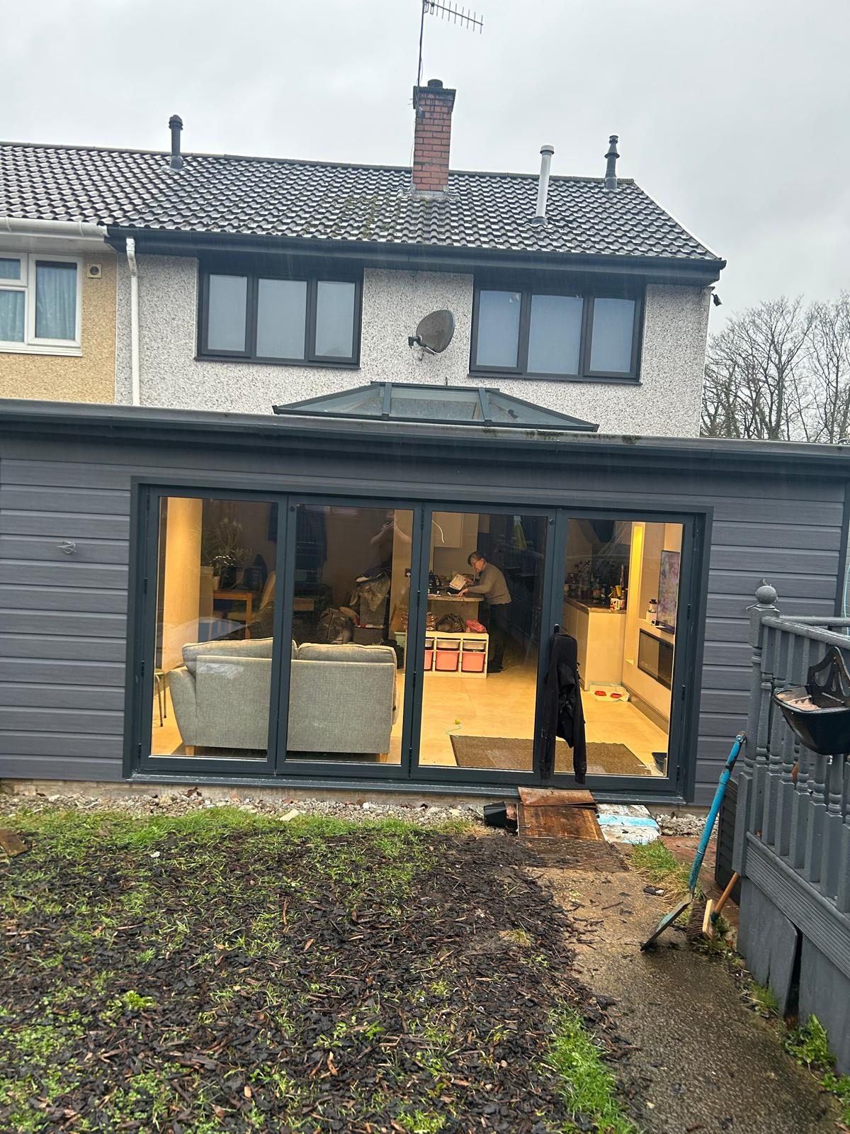 Grey-clad rear extension with large glazed doors completed by MB Construction in South Wales