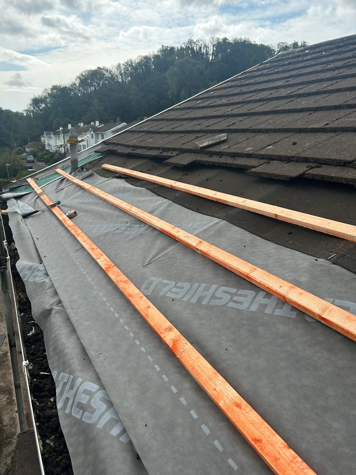 Full re-roof underway with breathable roofing membrane and new timber battens fixed across the rafters