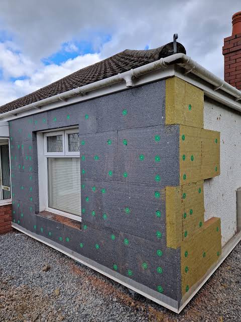 External wall insulation boards fixed to a bungalow wall ready for render in South Wales