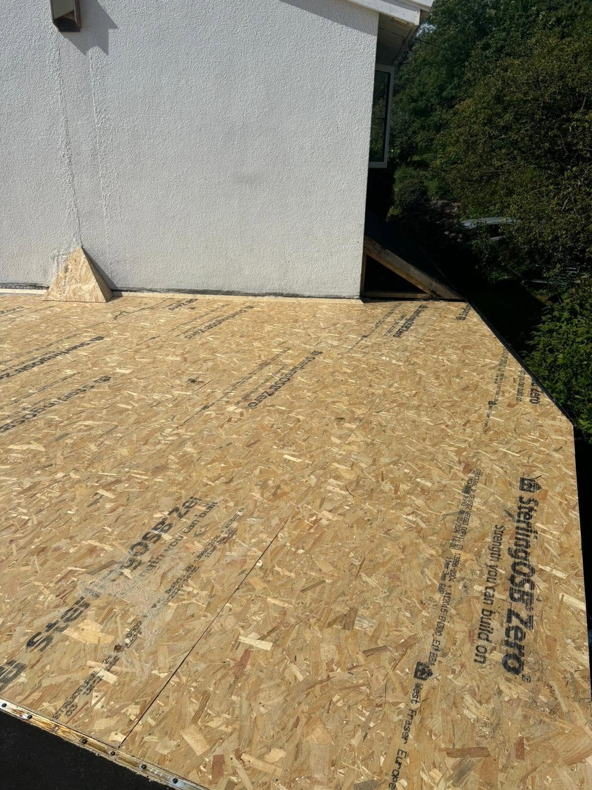 New OSB roof deck boarded out ready for a flat roof covering